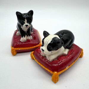 Ceramic Dog Cat Salt and Pepper Shakers Black and White on Red Pillow